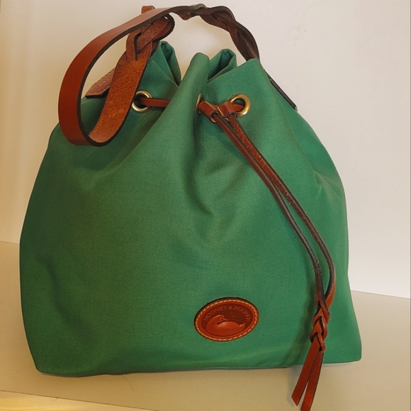 Dooney & Bourke Handbags - Like new!Dooney and bourke Bucket Canvas Green Bag